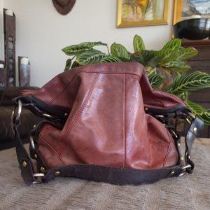 Large red and brown leather hobo bag with metal accents - Tashe